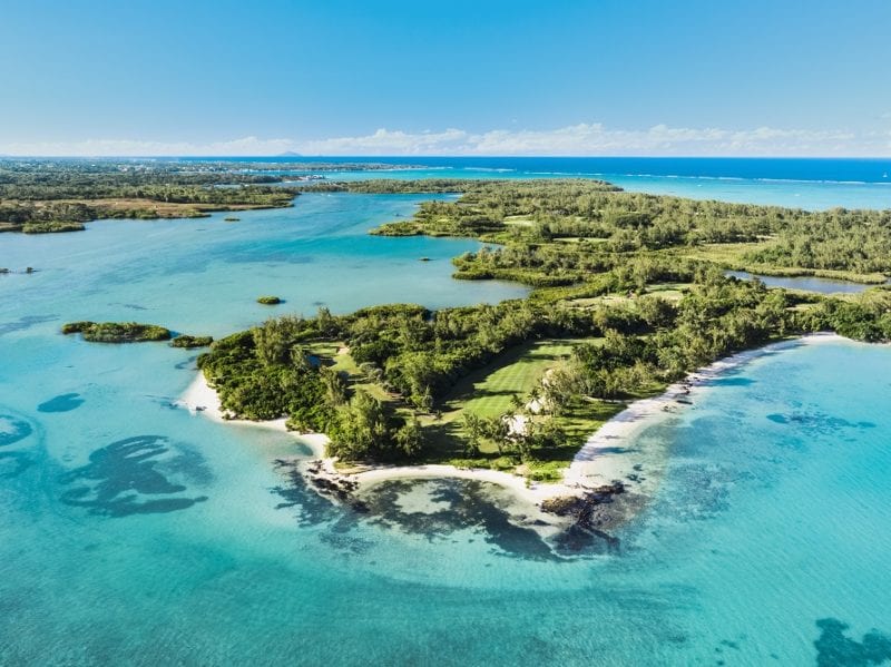 Ile aux Cerfs Golf Club and the very blue ocean and the island Mauritius