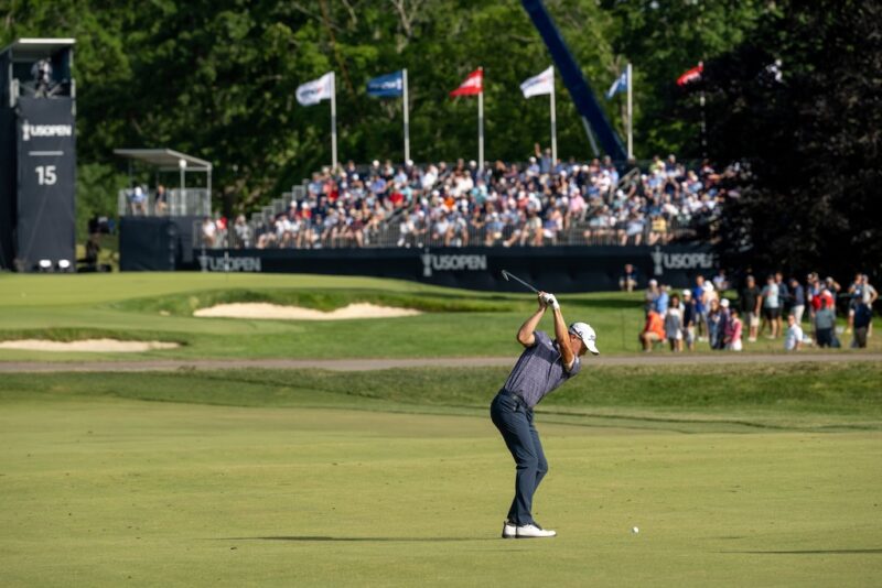 JUSTIN THOMAS PLAYS AN IRON APPROACH TO THE FIFTEENTH GREEN DURING THE 122ND U.S. OPEN USGA