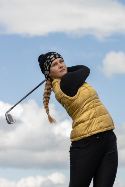 Chervo Autumn Winter Collection 2022-2023 female golfer in gold